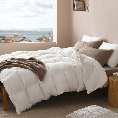 Bedroom with white duvet and Sleep Pillow, window light